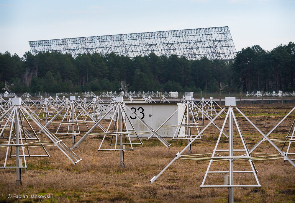 The NenuFAR telescope in front of the Nançay Radio Telescope.